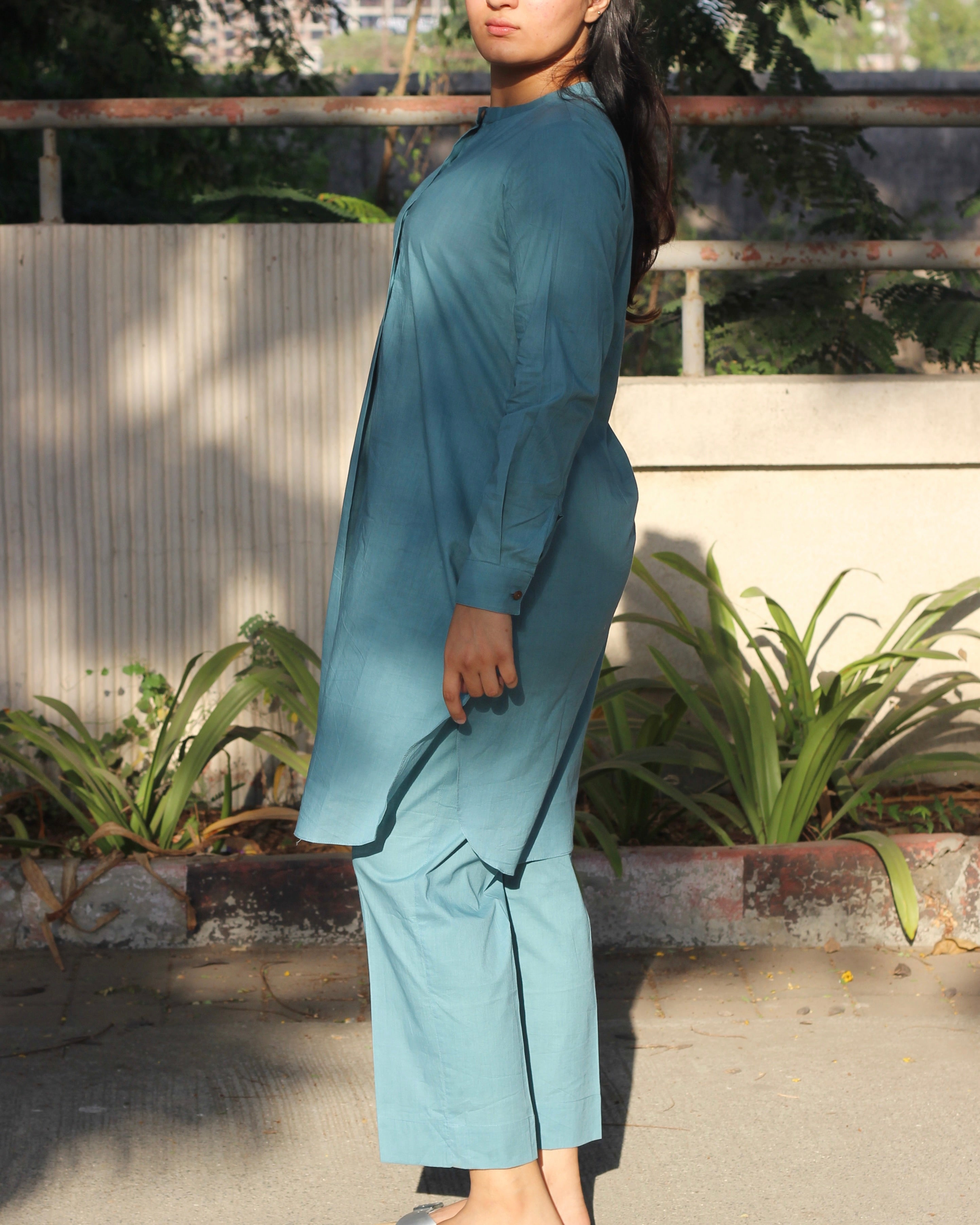 Pure Cambric Cotton Powder Blue Co-ord set featuring a long kurta with round side cuts and brown neck buttons, paired with soft and comfortable pants, ideal for versatile summer wear