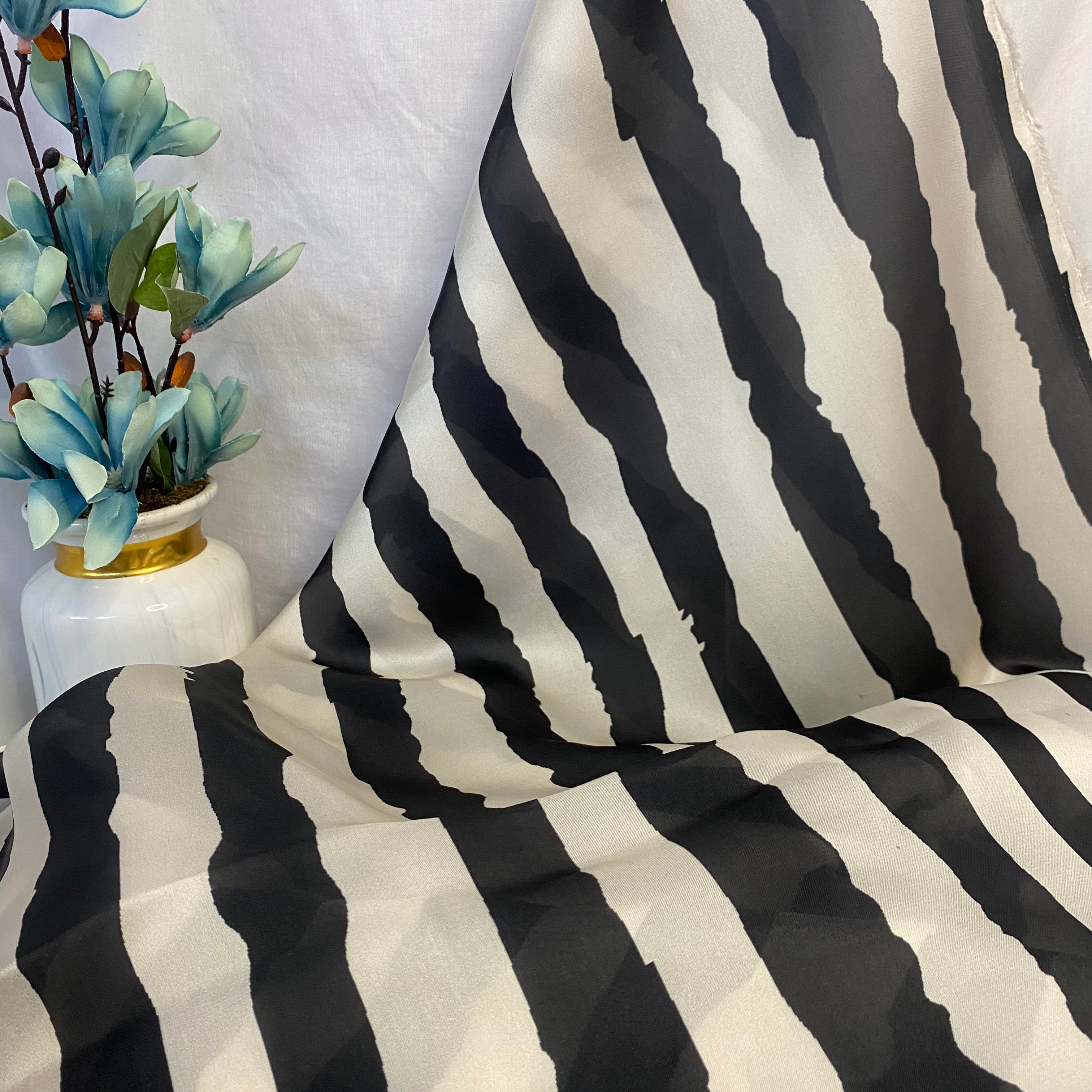 Black and off white water effect stripes print on georgette satin per meter