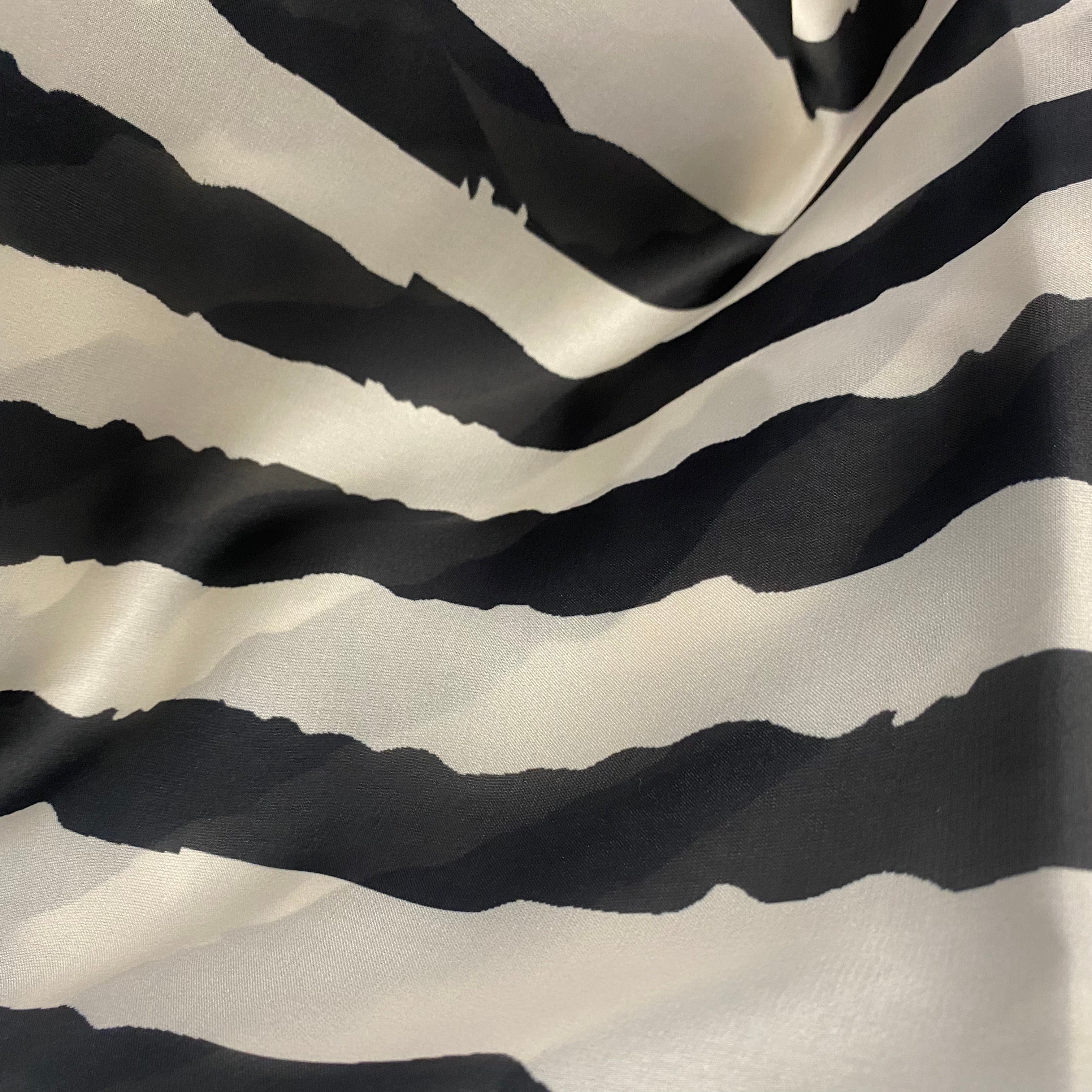 Black and off white water effect stripes print on georgette satin per meter