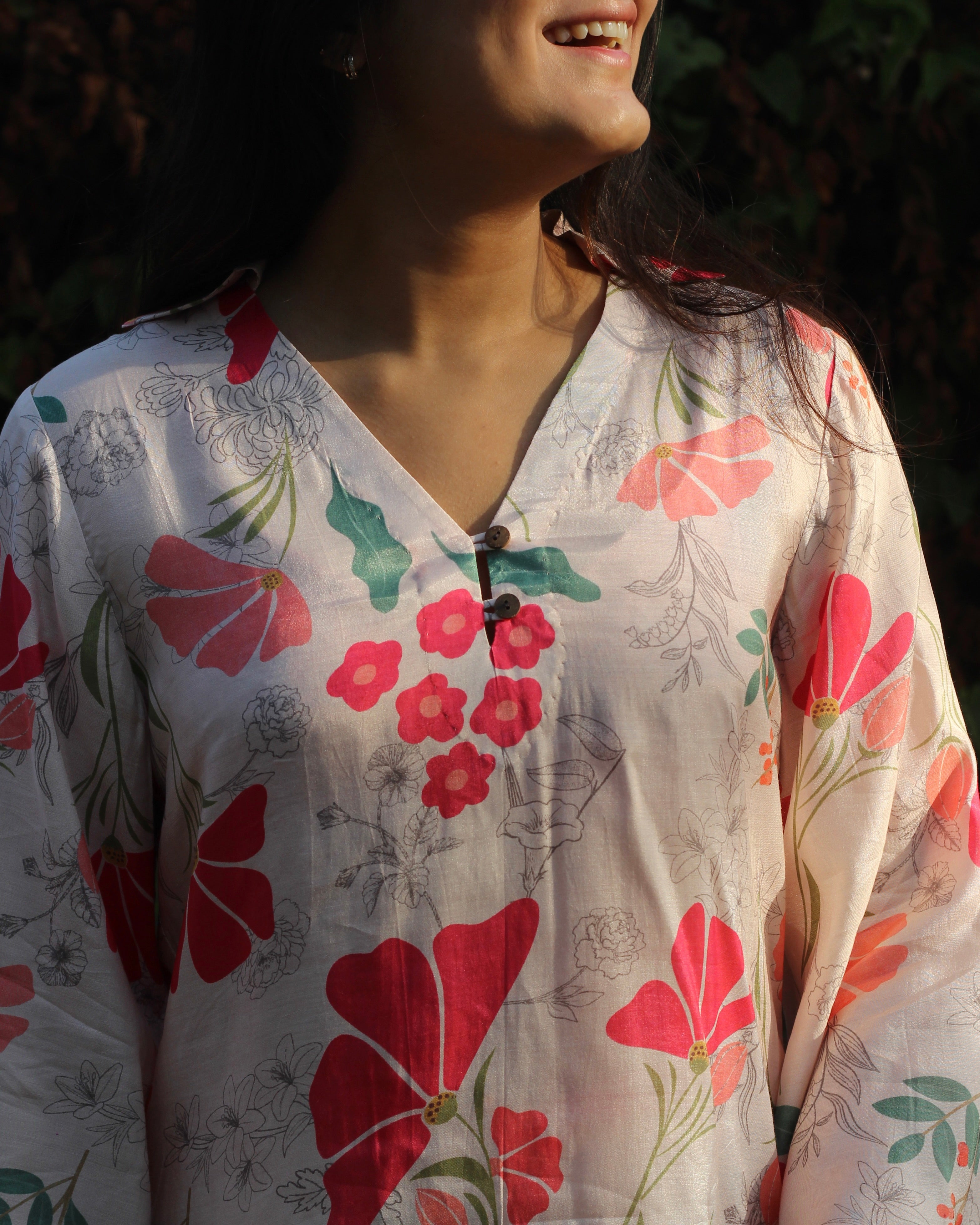 Neck detail of muslin floral top 