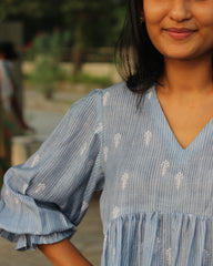 Blue stripes cotton linen dress in Alia cut with puff 3/4 sleeves and white motifs all over, showcasing our best-selling print