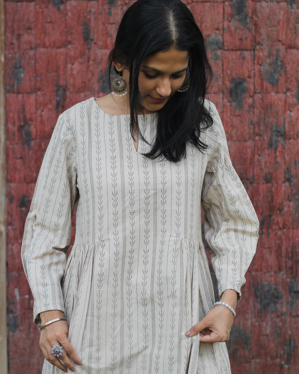 Beige handloom cotton kurta set with stripe pattern, side detail pockets, relaxed neck, and box 3/4 sleeves, paired with elastic waist pants