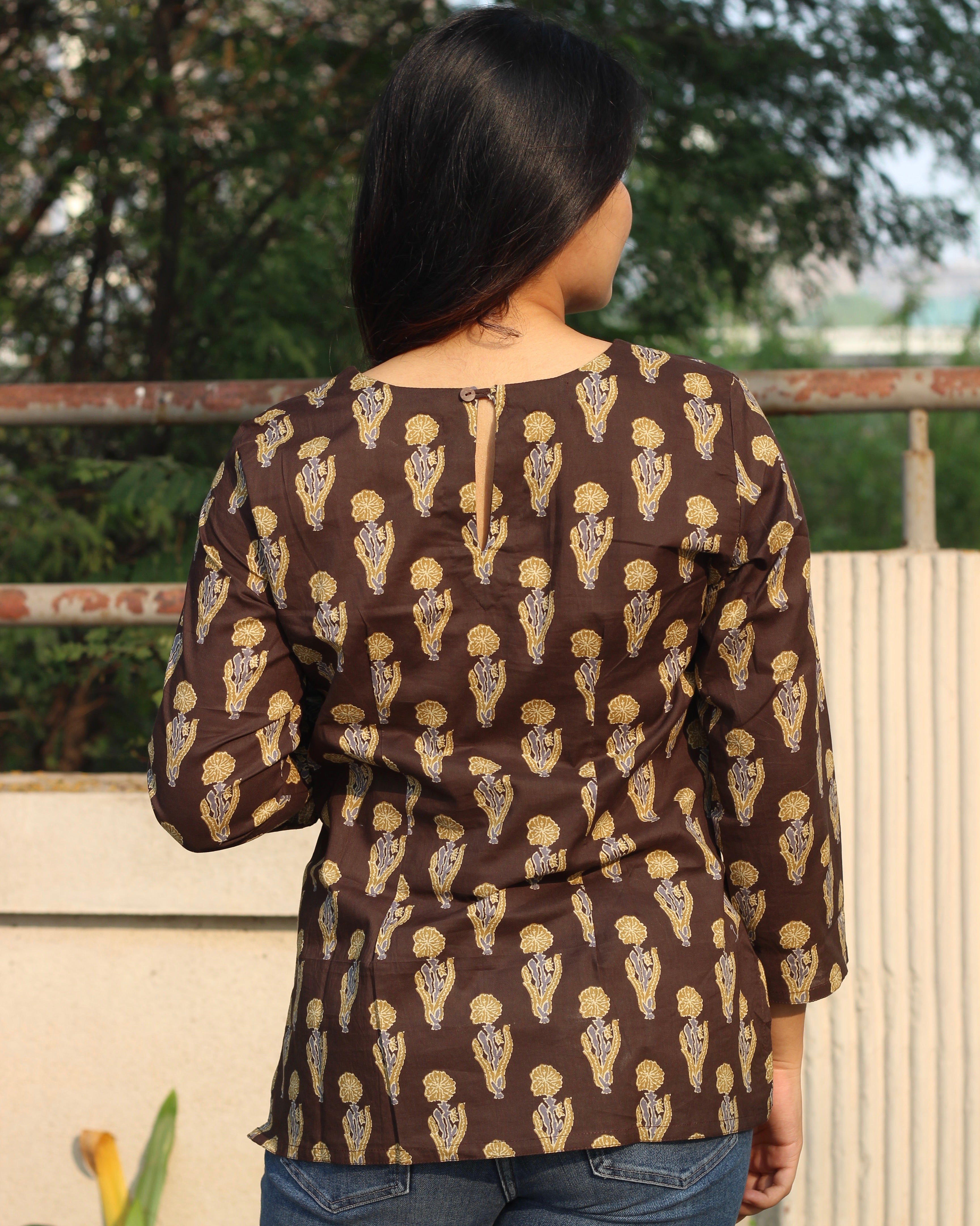 Comfortable brown printed short kurta with contrasting booti, ideal for casual outings or work wear, featuring 3/4 sleeves and a round neck