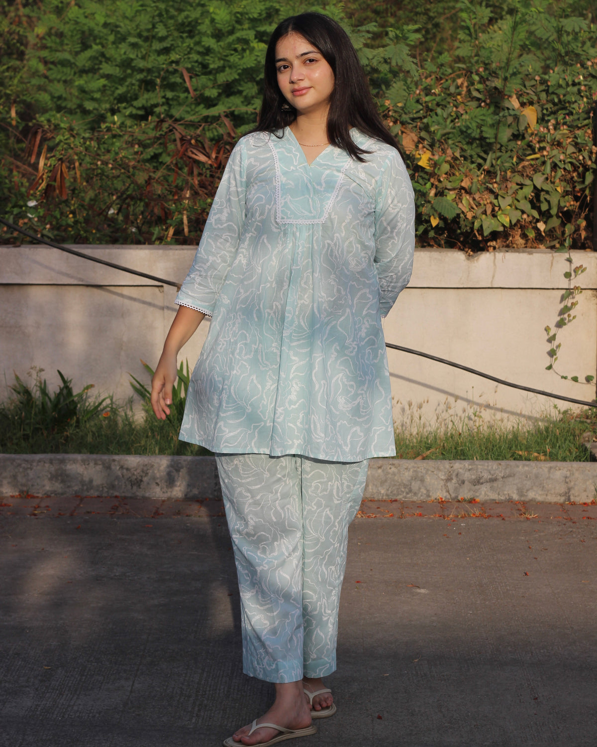 Light blue cambric cotton co-ord set with white abstract print, featuring a V-neck top with lace detail and matching pants