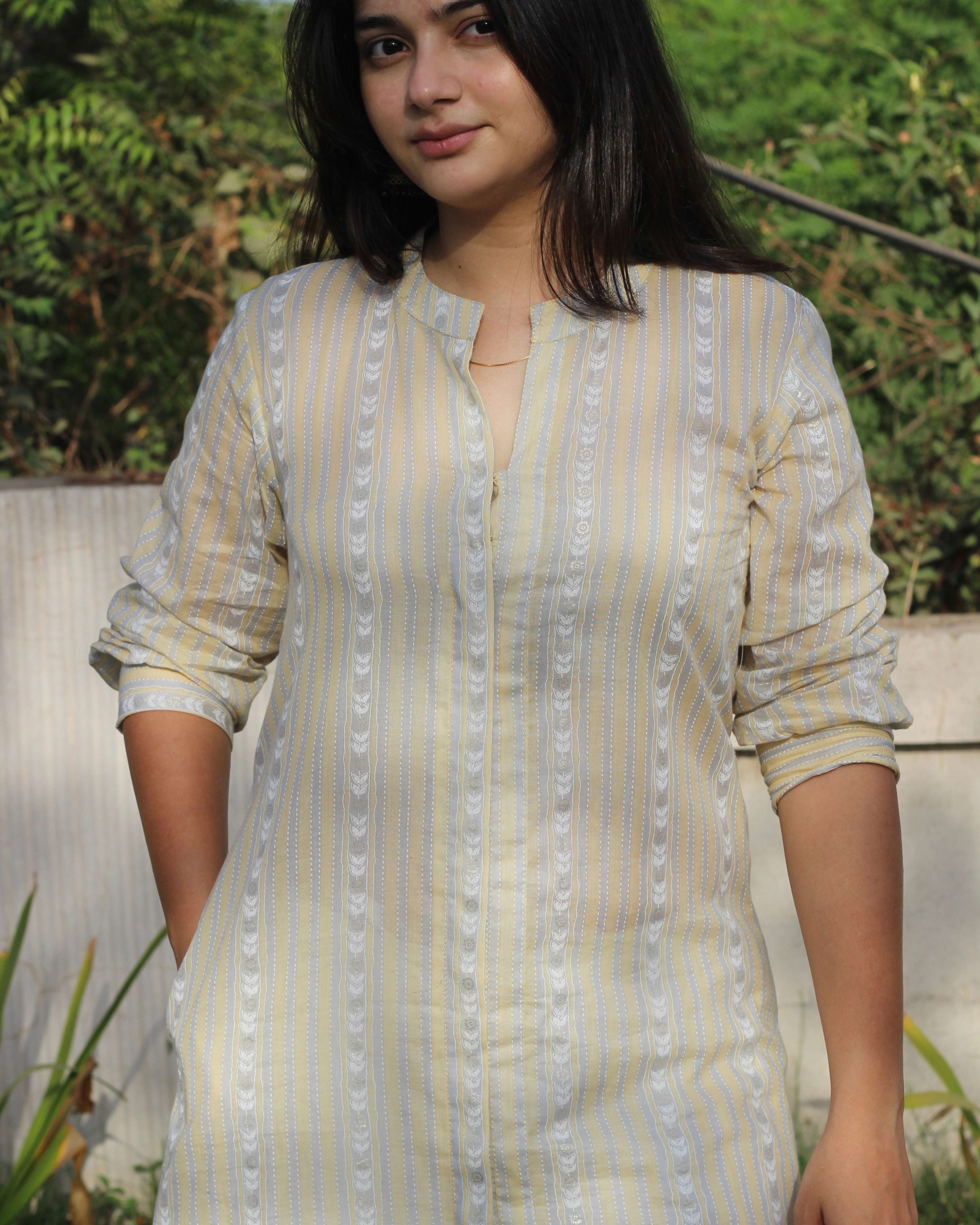 Image of Stripes Mul Cotton Long Kurta in subtle yellow, white, and grey stripes, featuring full sleeves, Chinese collar neck, and side cuts