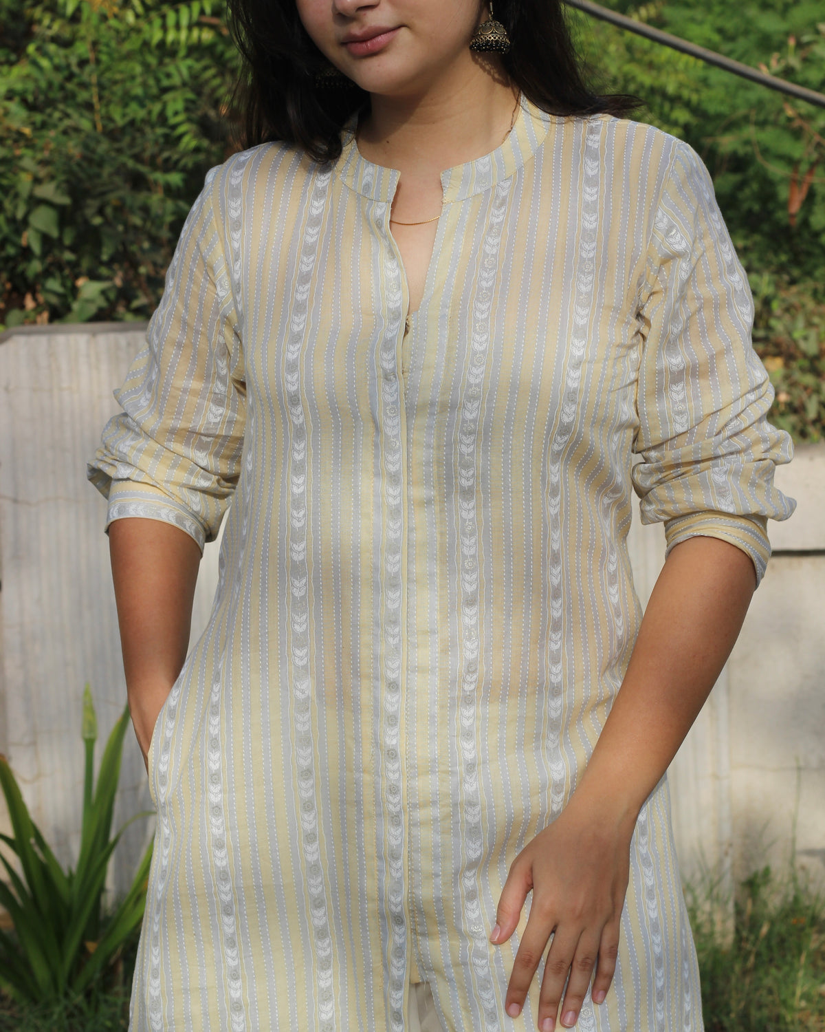 Image of Stripes Mul Cotton Long Kurta in subtle yellow, white, and grey stripes, featuring full sleeves, Chinese collar neck, and side cuts