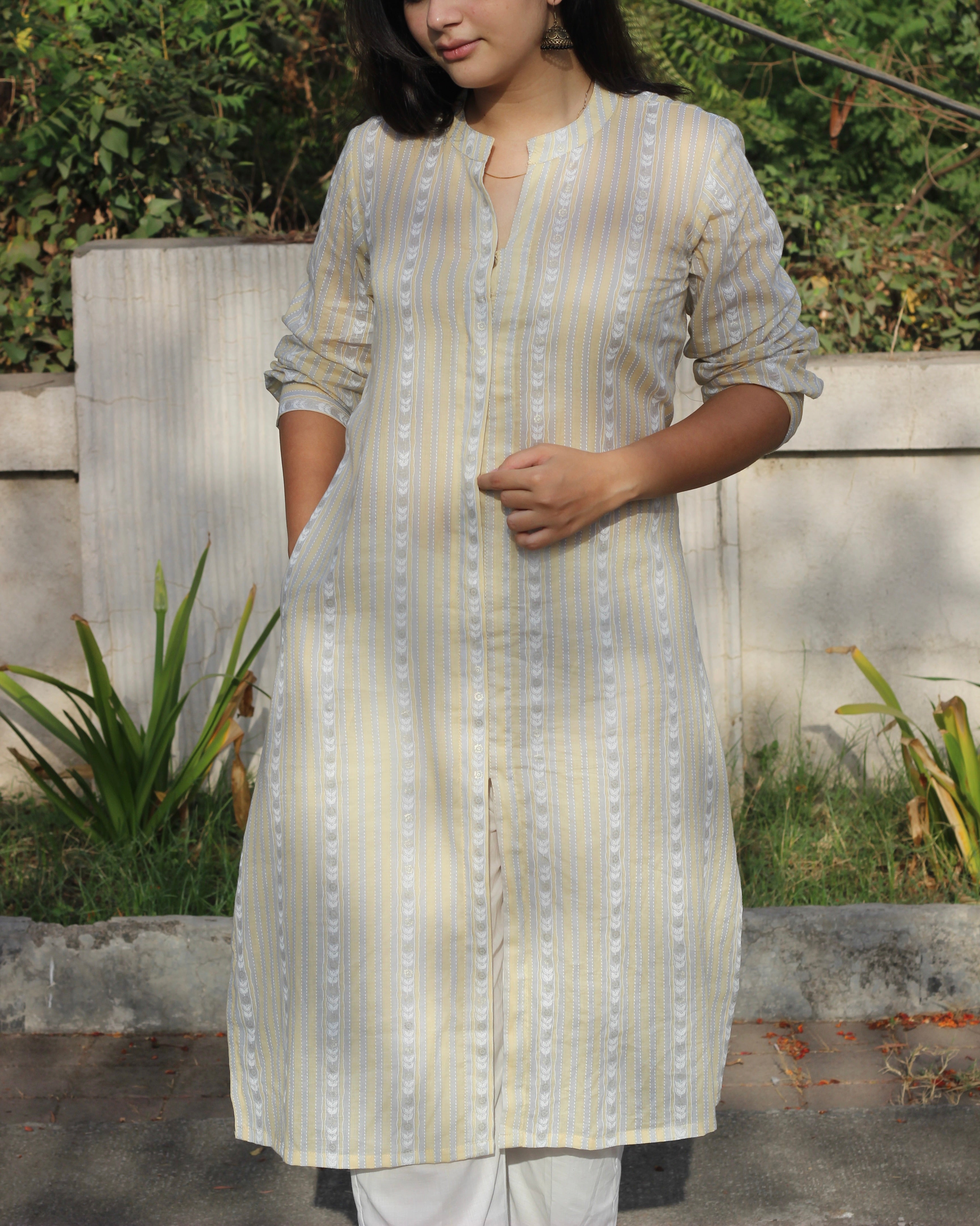 Image of Stripes Mul Cotton Long Kurta in subtle yellow, white, and grey stripes, featuring full sleeves, Chinese collar neck, and side cuts