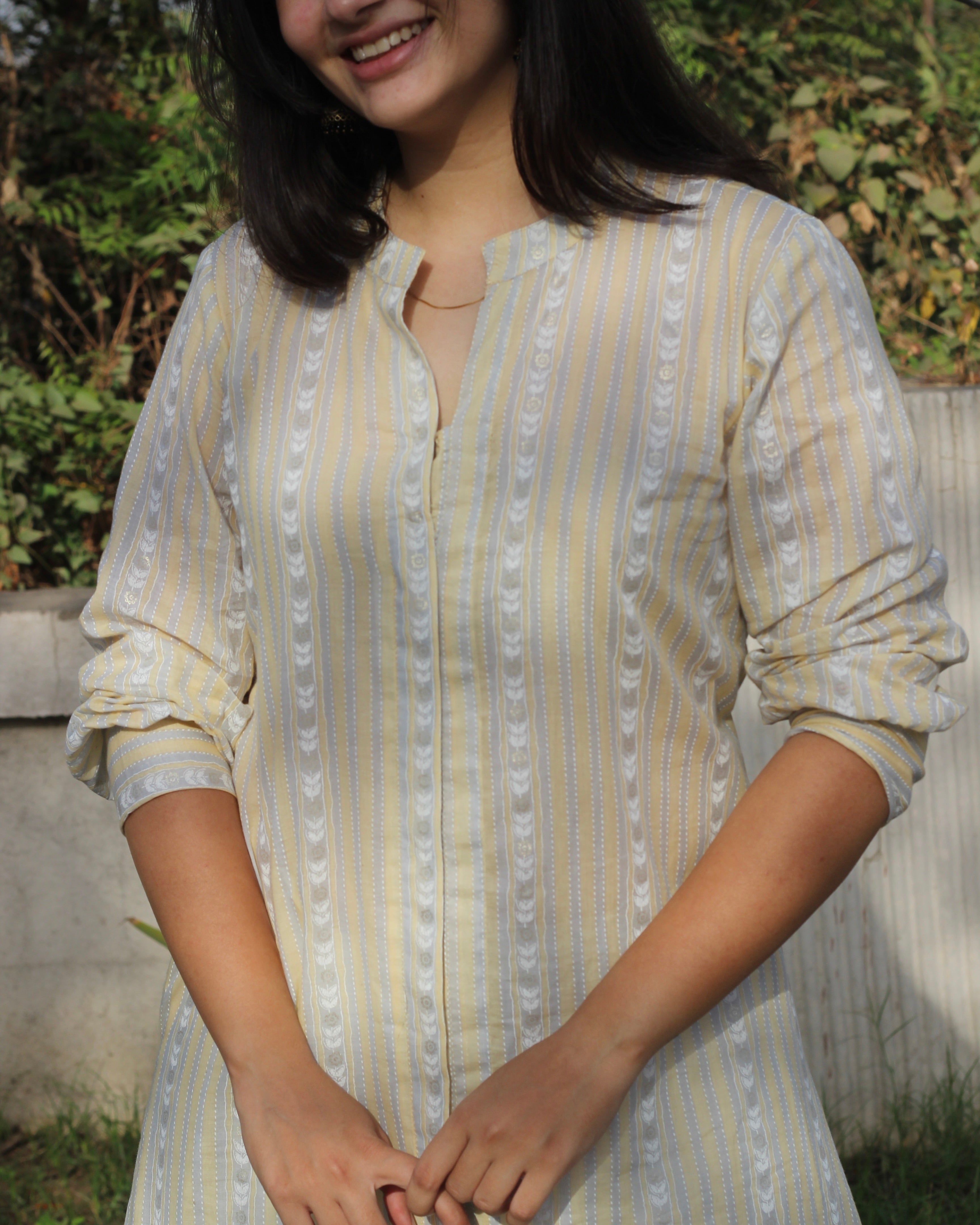 Image of Stripes Mul Cotton Long Kurta in subtle yellow, white, and grey stripes, featuring full sleeves, Chinese collar neck, and side cuts