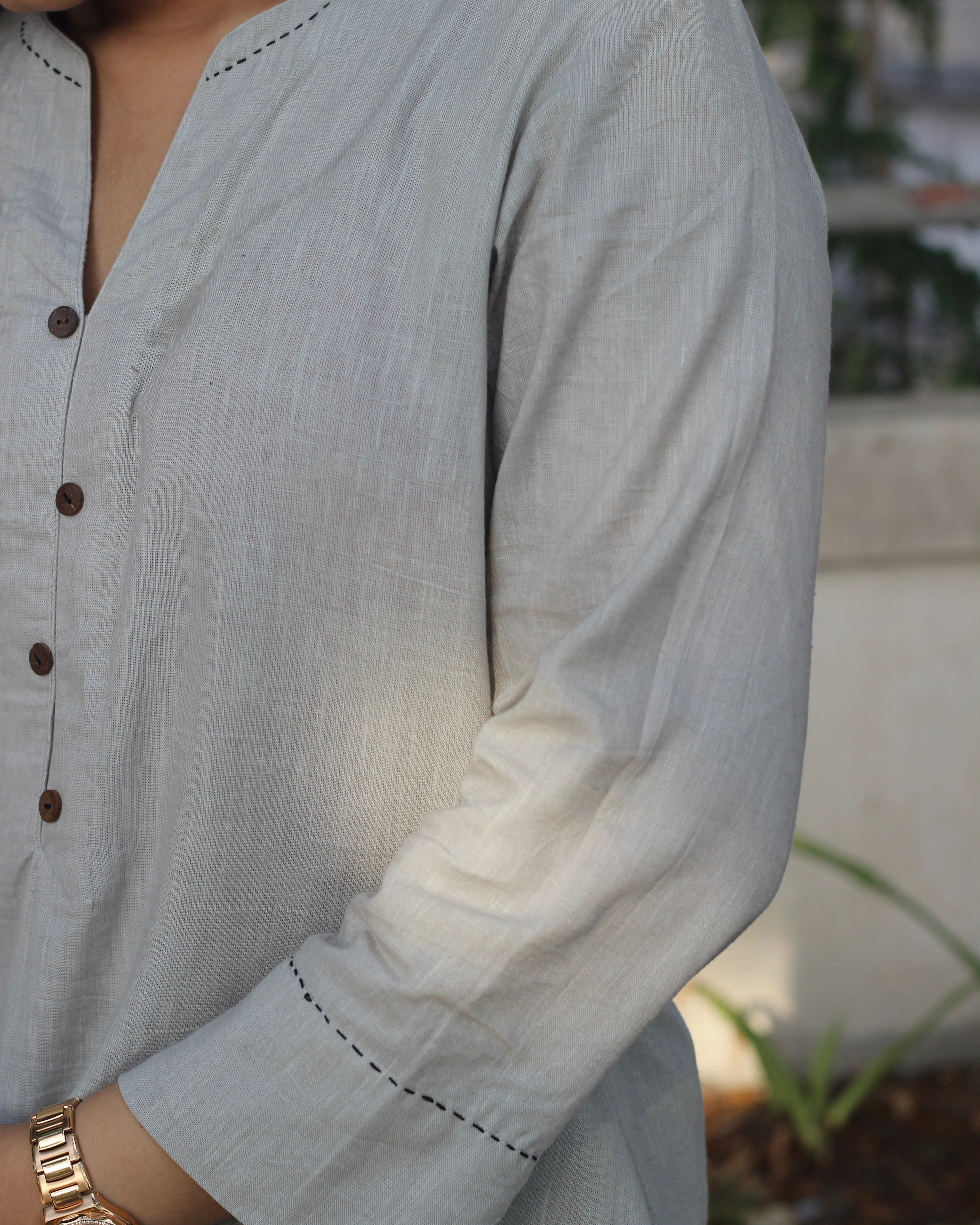 Grey Linen Kurta with Black Handwork Neck Detail, Brown Buttons, A-Line Design, and Side Pockets
