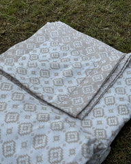 Set of 2 Reversible Dohars - Beige Ikkat Print on White Base and White Ikkat Print on Beige Base, each measuring 1.5 x 2.3 meters