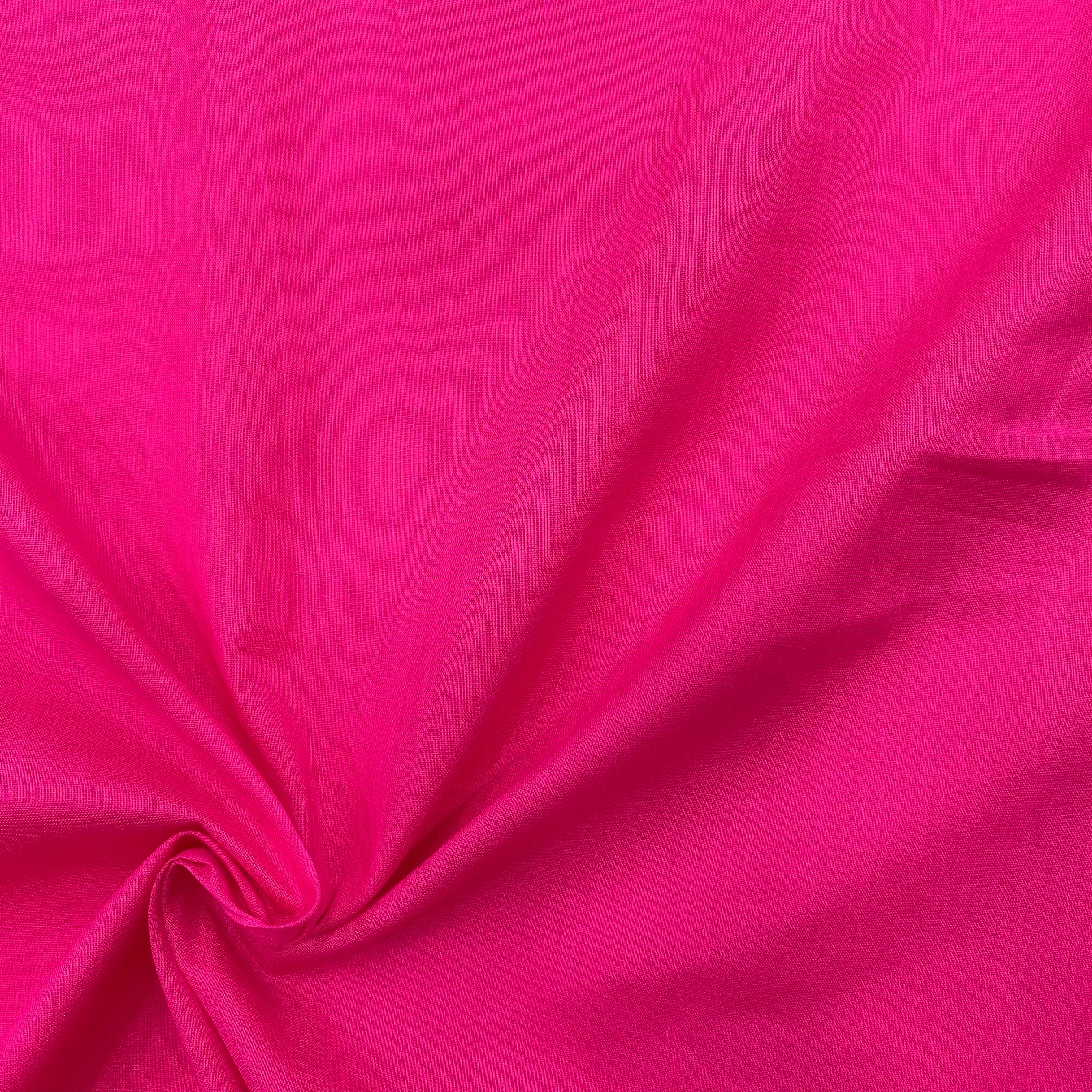 Close-up of the hot pink mul cotton, showcasing the fine weave and quality craftsmanship