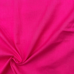 Close-up of the hot pink mul cotton, showcasing the fine weave and quality craftsmanship