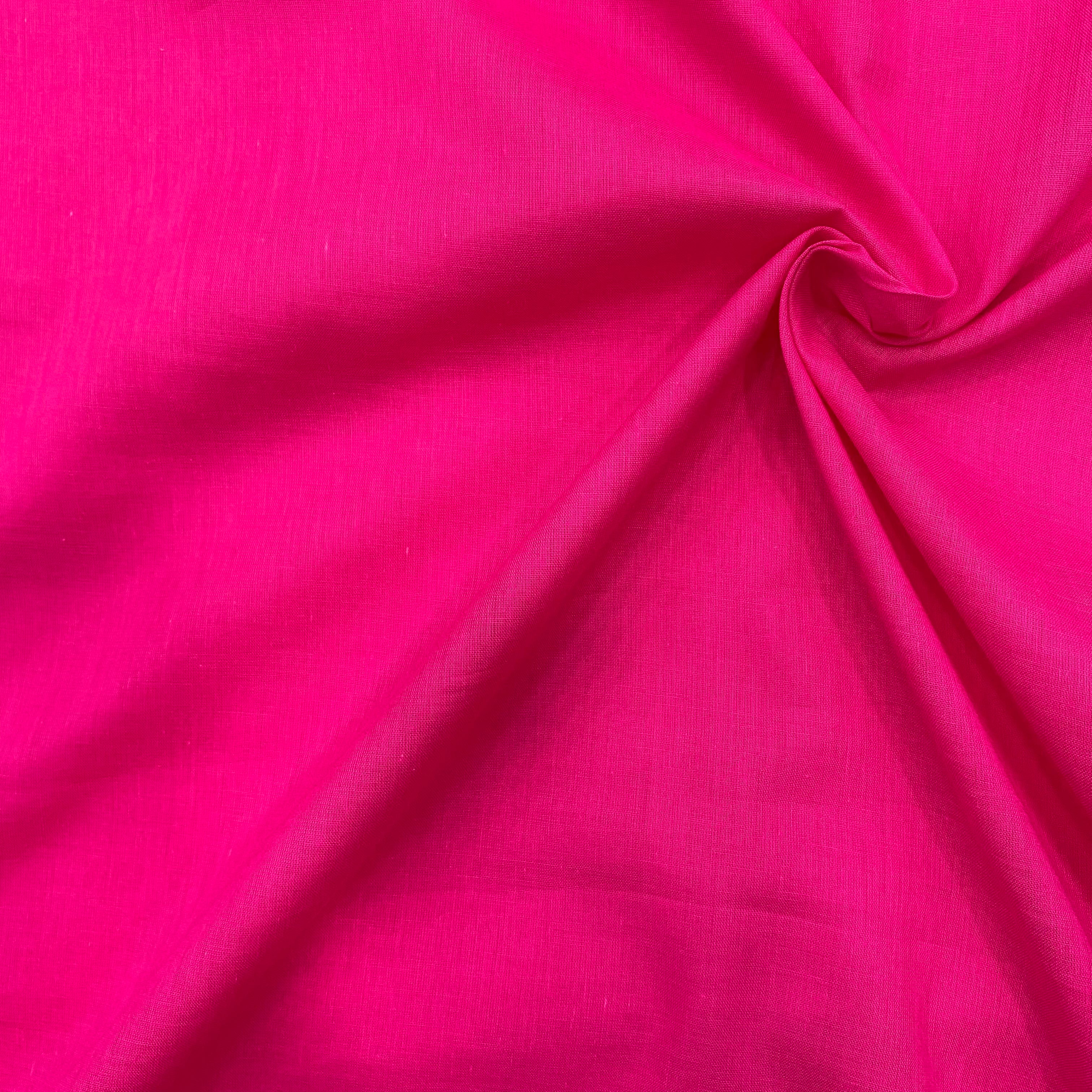 Close-up of the hot pink mul cotton, showcasing the fine weave and quality craftsmanship_2