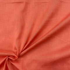 Image of light rust orange mul cotton fabric, soft and breathable, perfect for summer