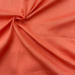 Image of light rust orange mul cotton fabric, soft and breathable, perfect for summer