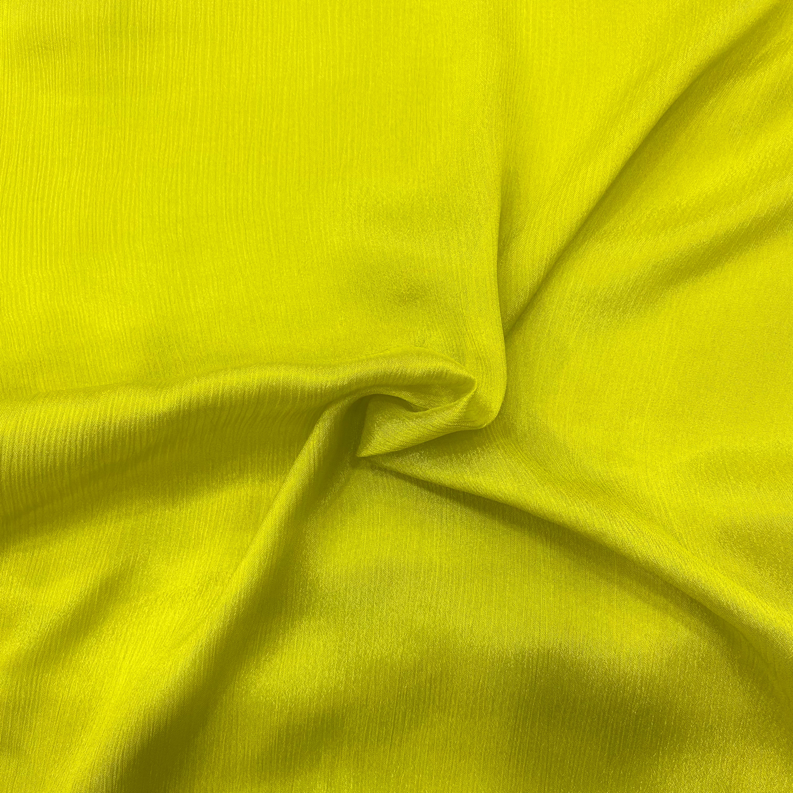 Close-up of Lime Green Chinon's texture, emphasizing its quality and softness