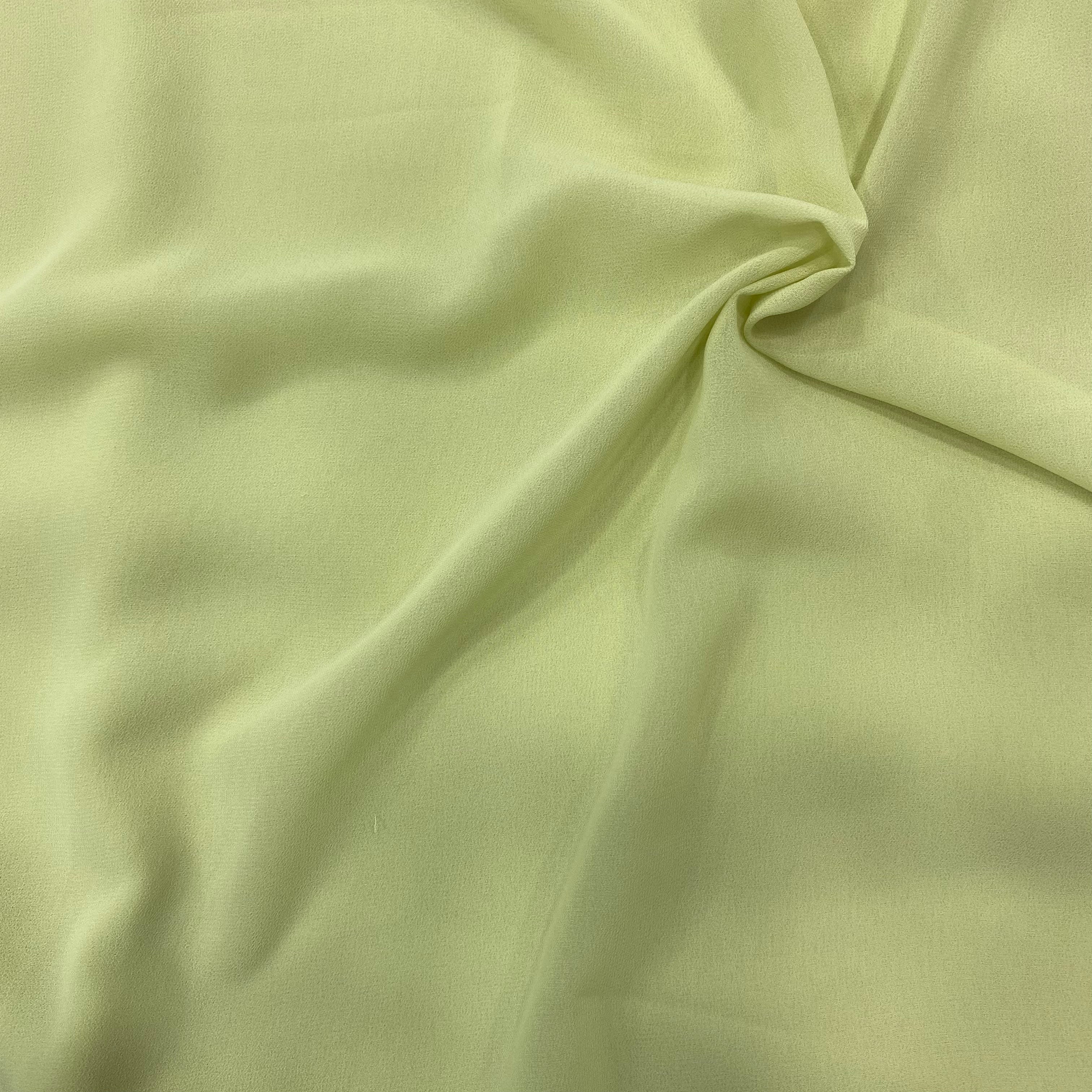 Pastel green georgette fabric swatch, soft and luxurious, perfect for flowly ensembles