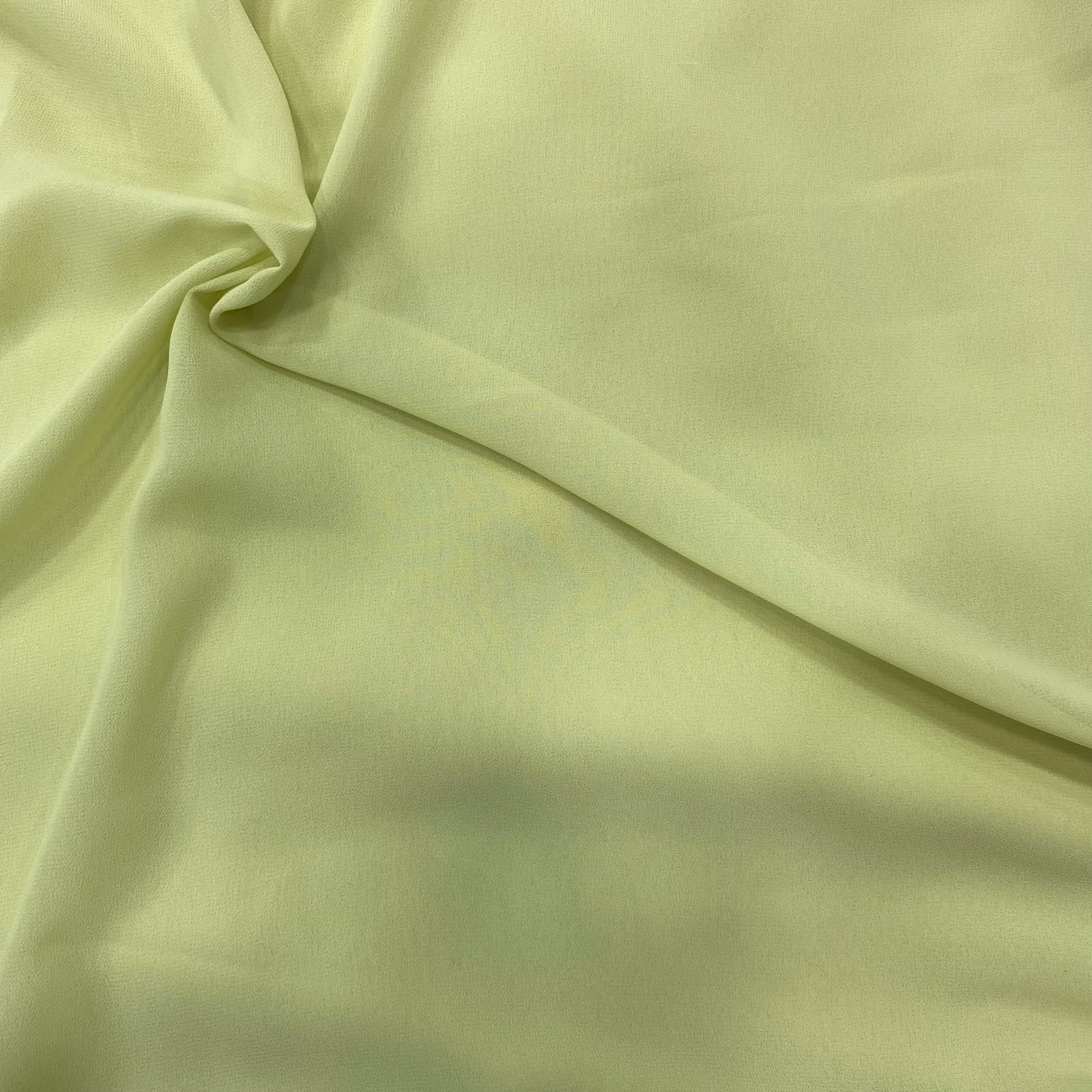 Pastel green georgette fabric swatch, soft and luxurious, perfect for flowly ensembles