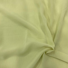 Pastel green georgette fabric swatch, soft and luxurious, perfect for flowly ensembles