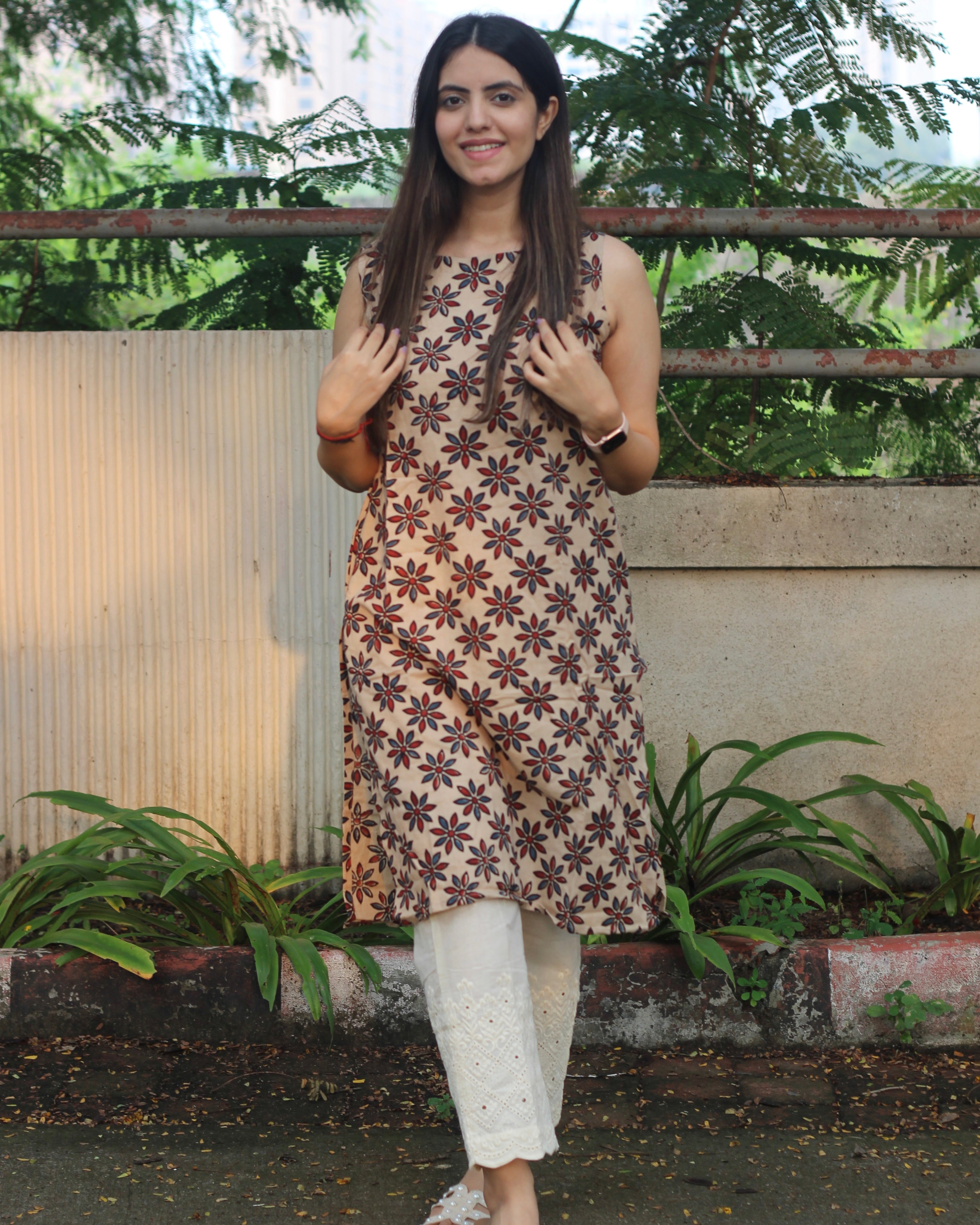 Sleeveless Ivory Kurta with Blue and Red Symmetrical Flower Print, Boat Neck, and Side Cut