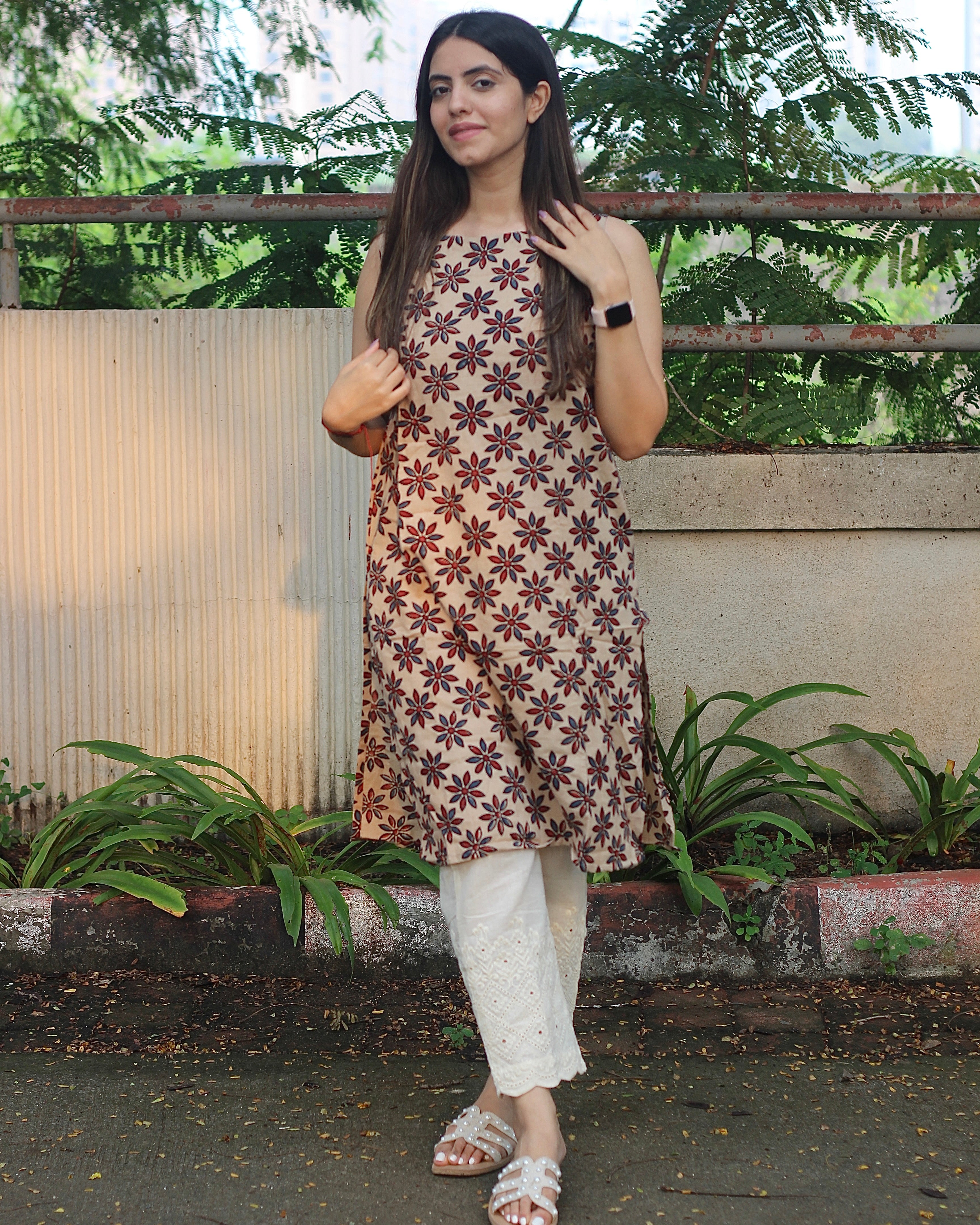 Sleeveless Ivory Kurta with Blue and Red Symmetrical Flower Print, Boat Neck, and Side Cut