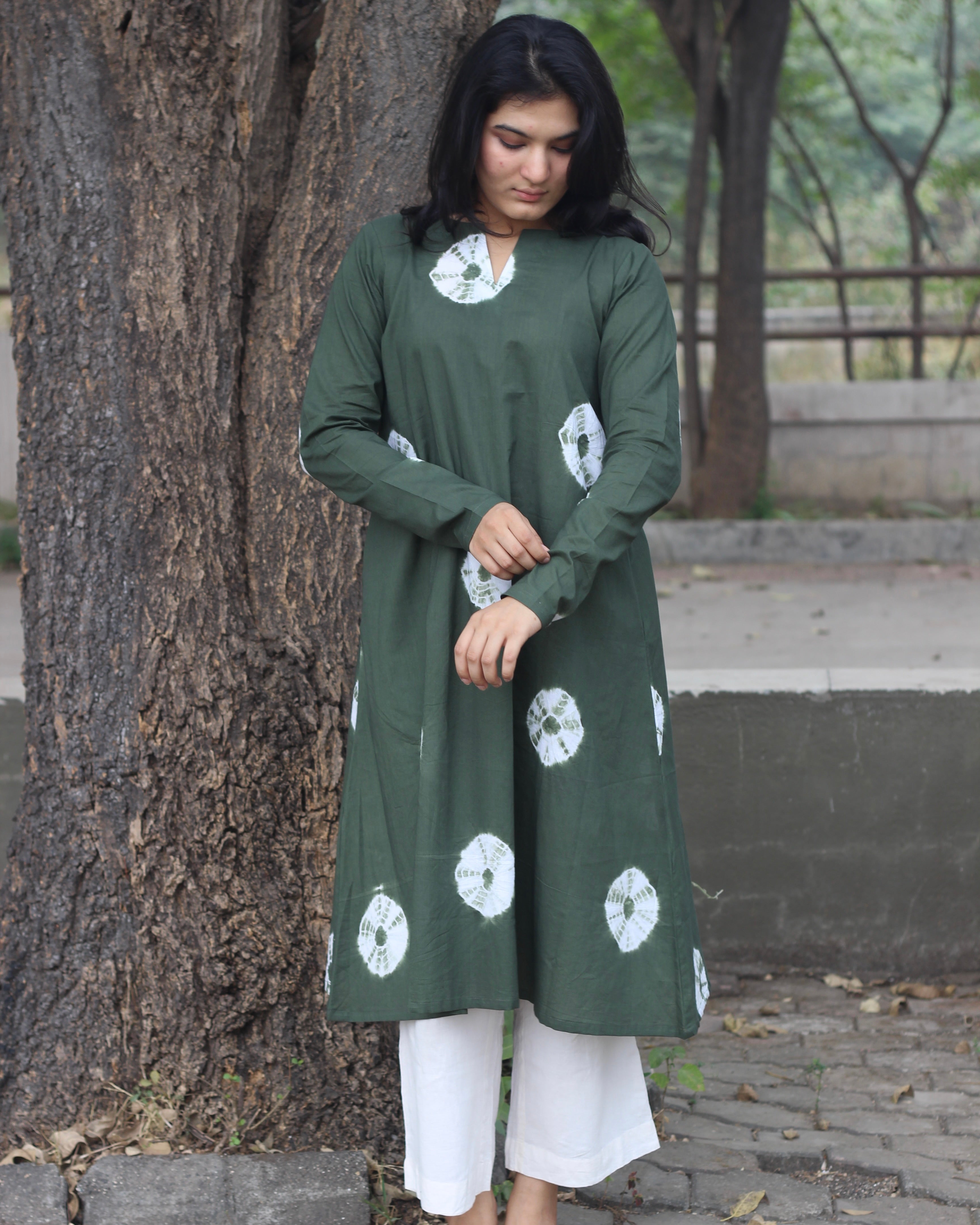 Dark green tye-dye bandhani pure cotton kurta with white bandhani print, long sleeves, V-neck, and pockets.