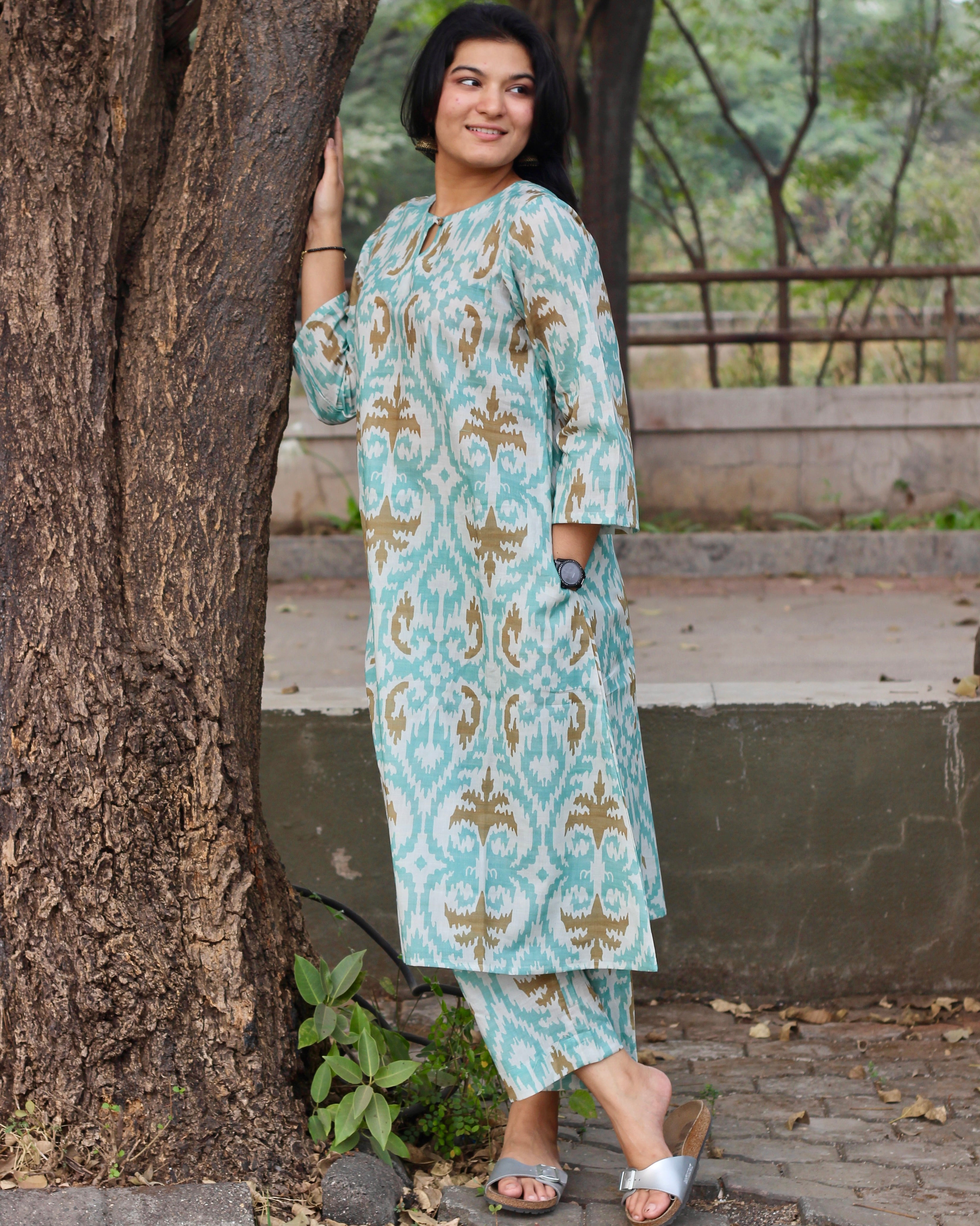 Sky blue ikkat print premium cotton kurta and pant set with a white base and light brown accents.