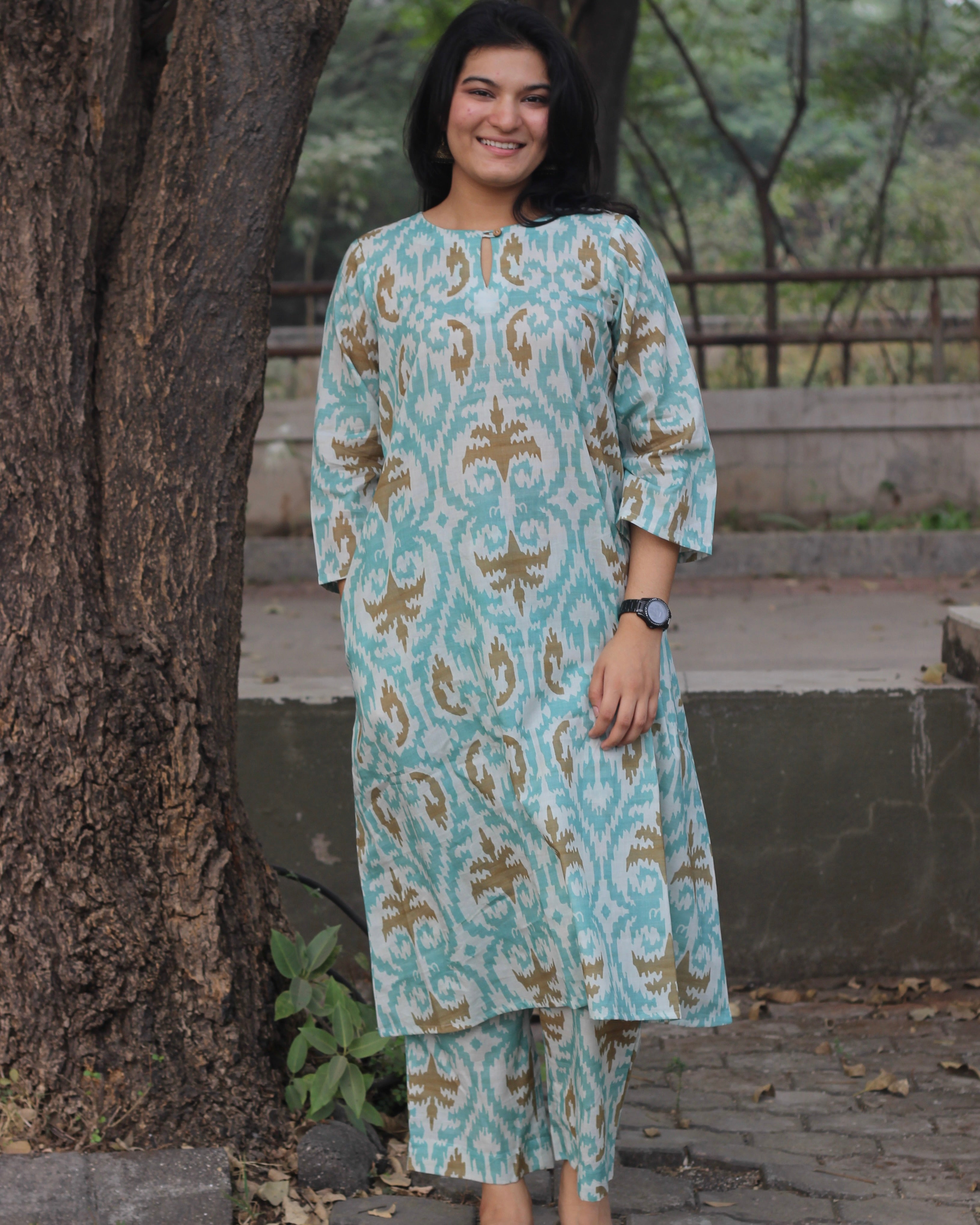 Sky blue ikkat print premium cotton kurta and pant set with a white base and light brown accents.