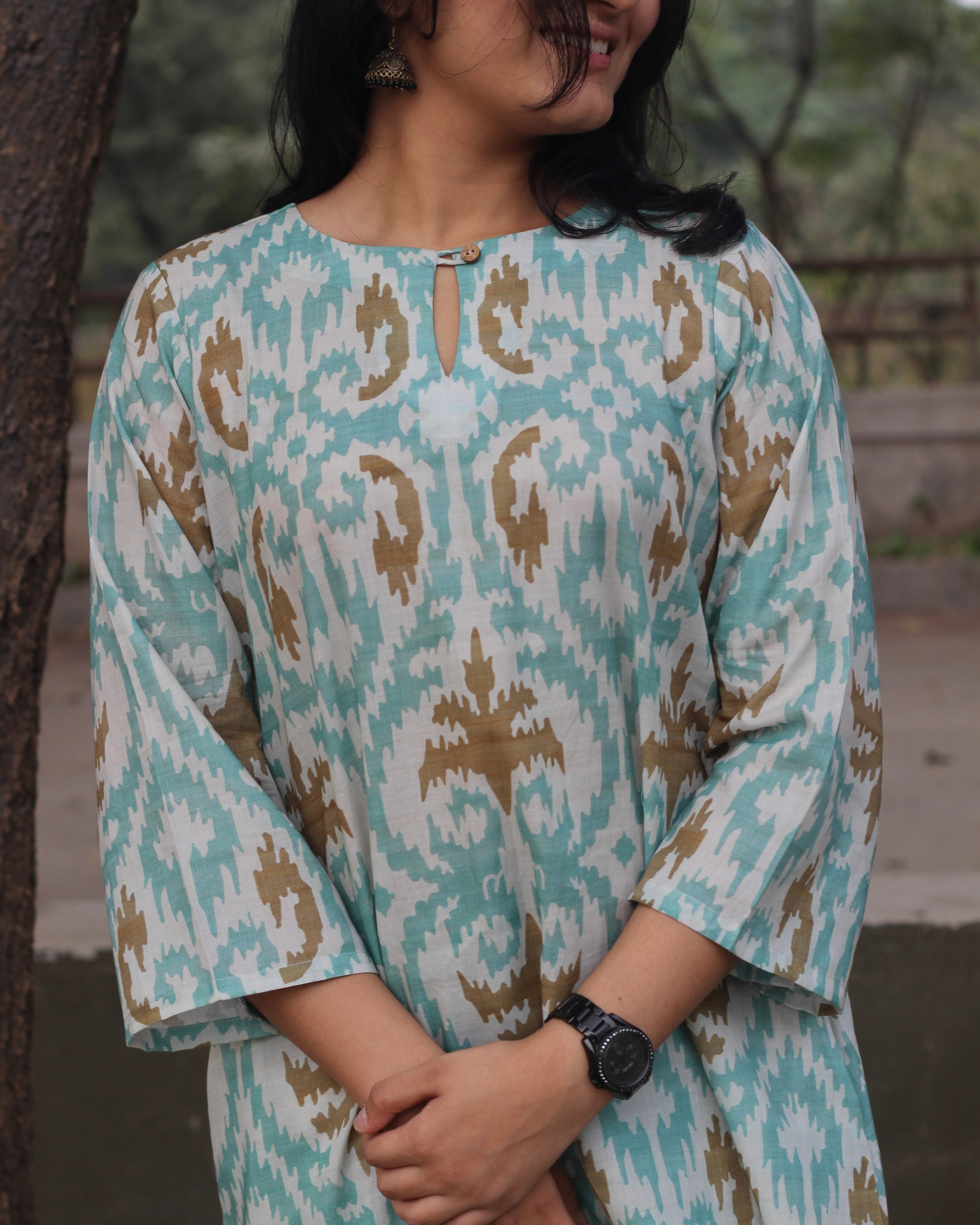 Sky blue ikkat print premium cotton kurta and pant set with a white base and light brown accents.