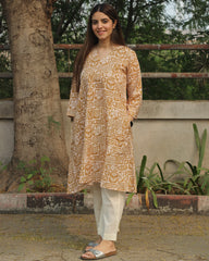 Mustard Harmony Long Kurta in premium cotton with mustard yellow and white floral-geometric print, styled with white pants