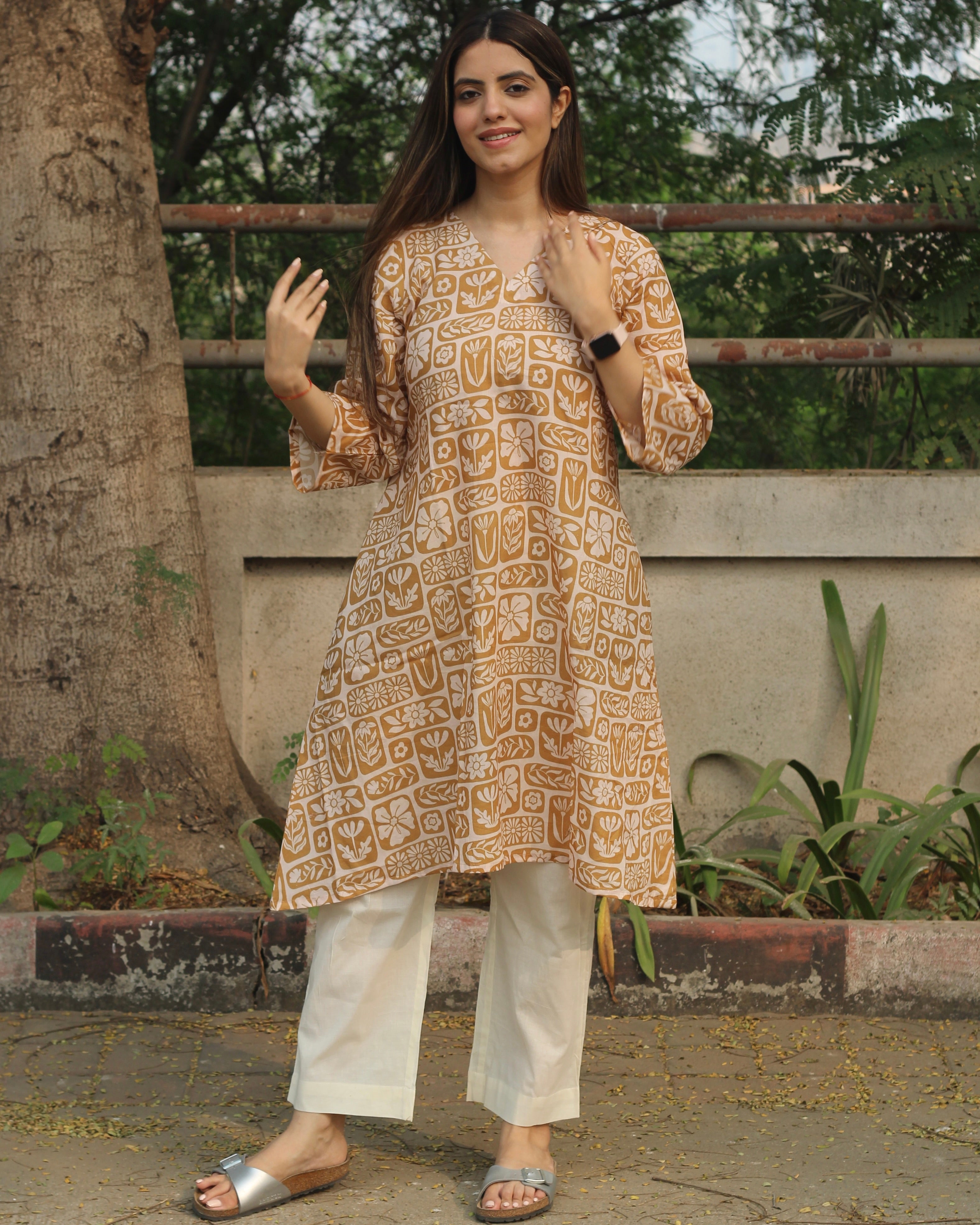 Mustard Harmony Long Kurta in premium cotton with mustard yellow and white floral-geometric print, styled with white pants