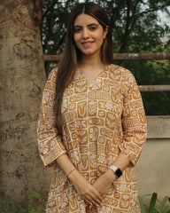 Mustard Harmony Long Kurta in premium cotton with mustard yellow and white floral-geometric print, styled with white pants