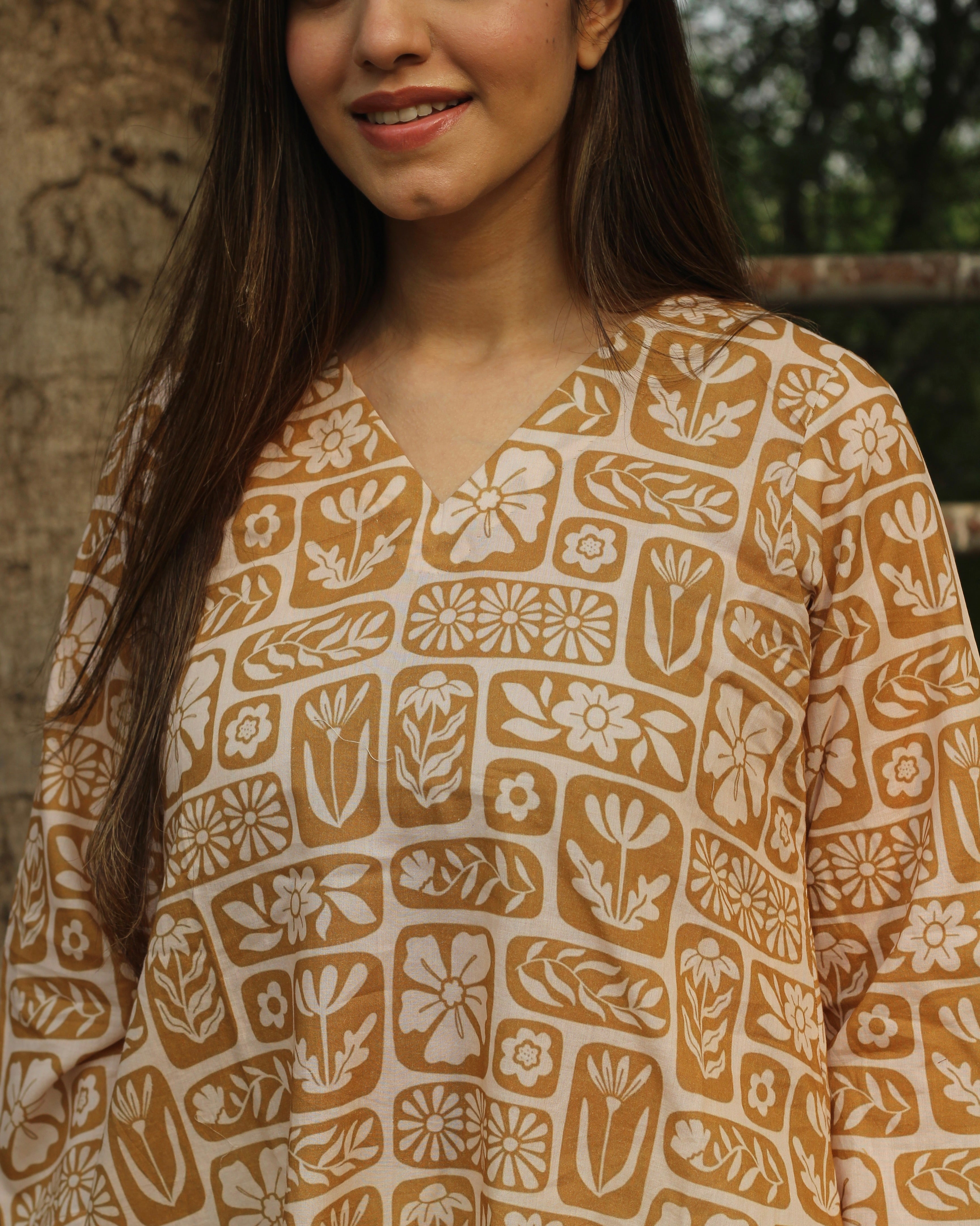 Mustard Harmony Long Kurta in premium cotton with mustard yellow and white floral-geometric print, styled with white pants