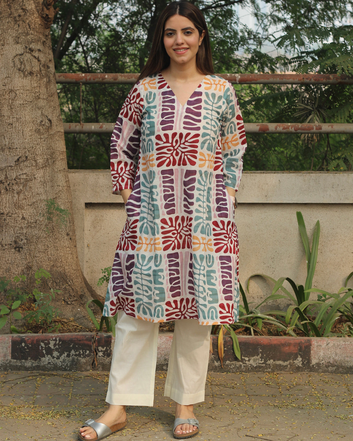 Prism Abstract Print Long Kurta in Multicolor with V-neck and side pockets, crafted from premium cotton, paired with white pants.