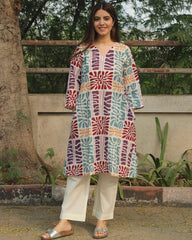 Prism Abstract Print Long Kurta in Multicolor with V-neck and side pockets, crafted from premium cotton, paired with white pants.