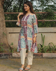 Prism Abstract Print Long Kurta in Multicolor with V-neck and side pockets, crafted from premium cotton, paired with white pants.