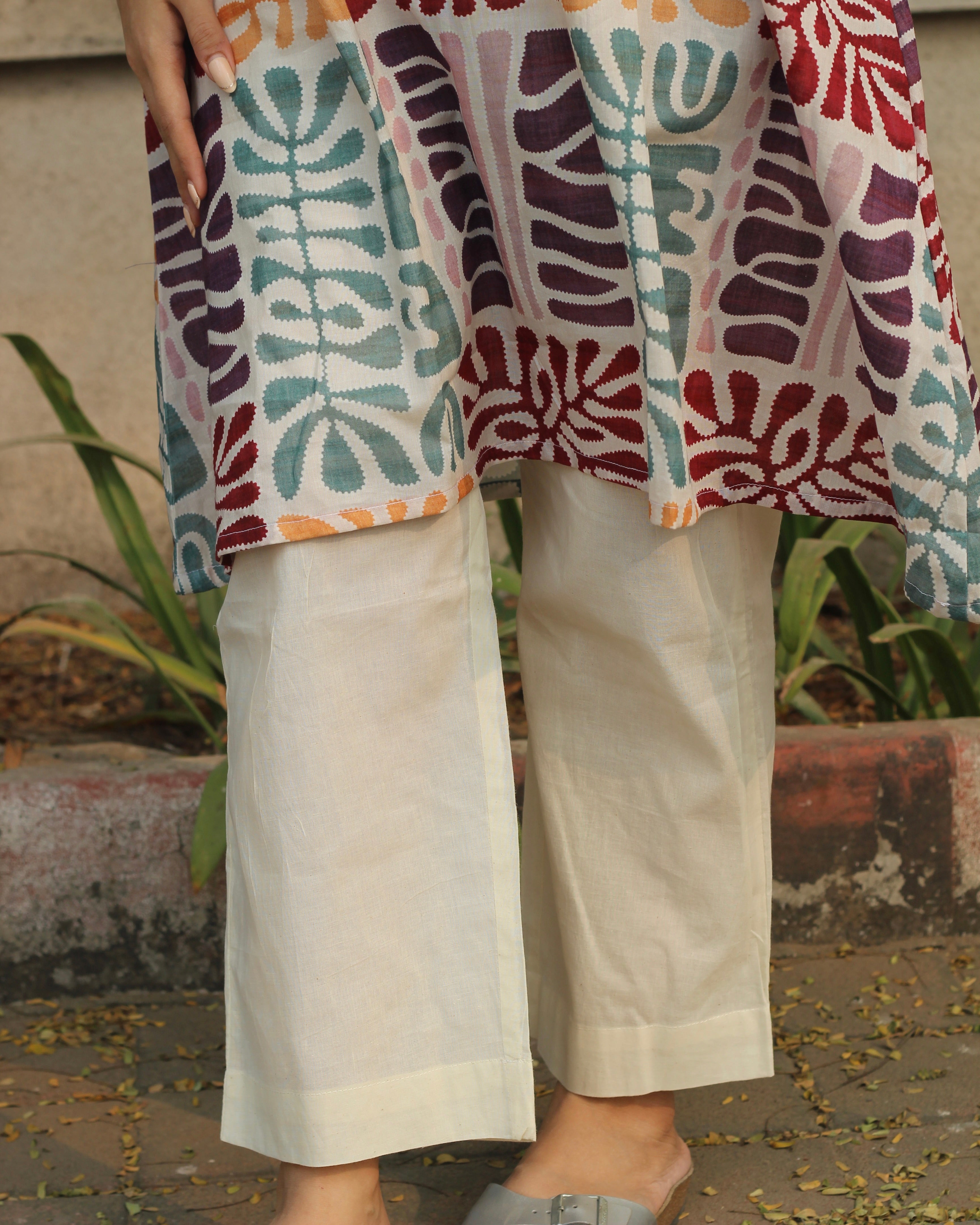 Prism Abstract Print Long Kurta in Multicolor with V-neck and side pockets, crafted from premium cotton, paired with white pants.