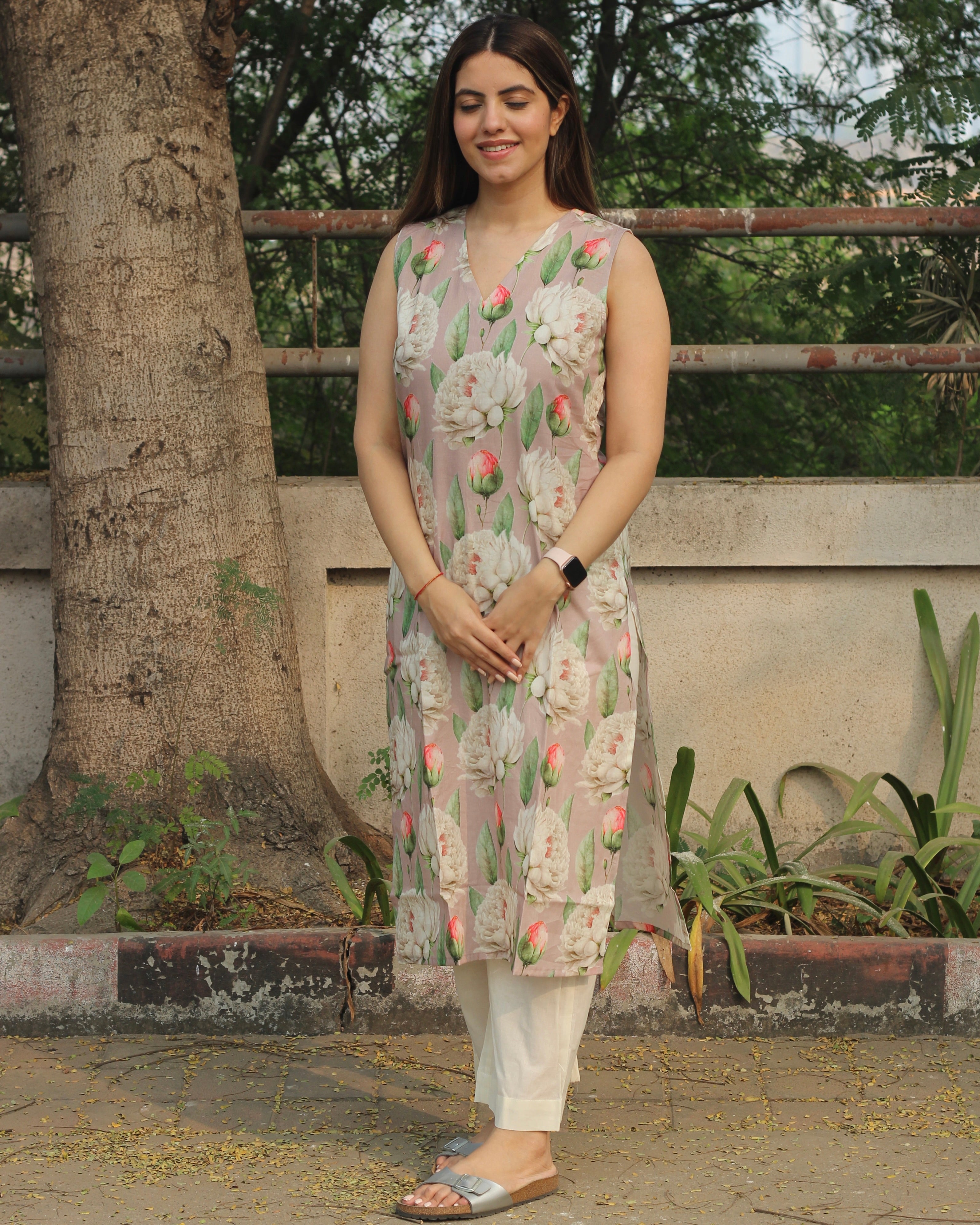 Floral Bliss Sleeveless V-neck Long Kurta in premium cotton, featuring floral print on light mauve base and side cuts, paired with white pants