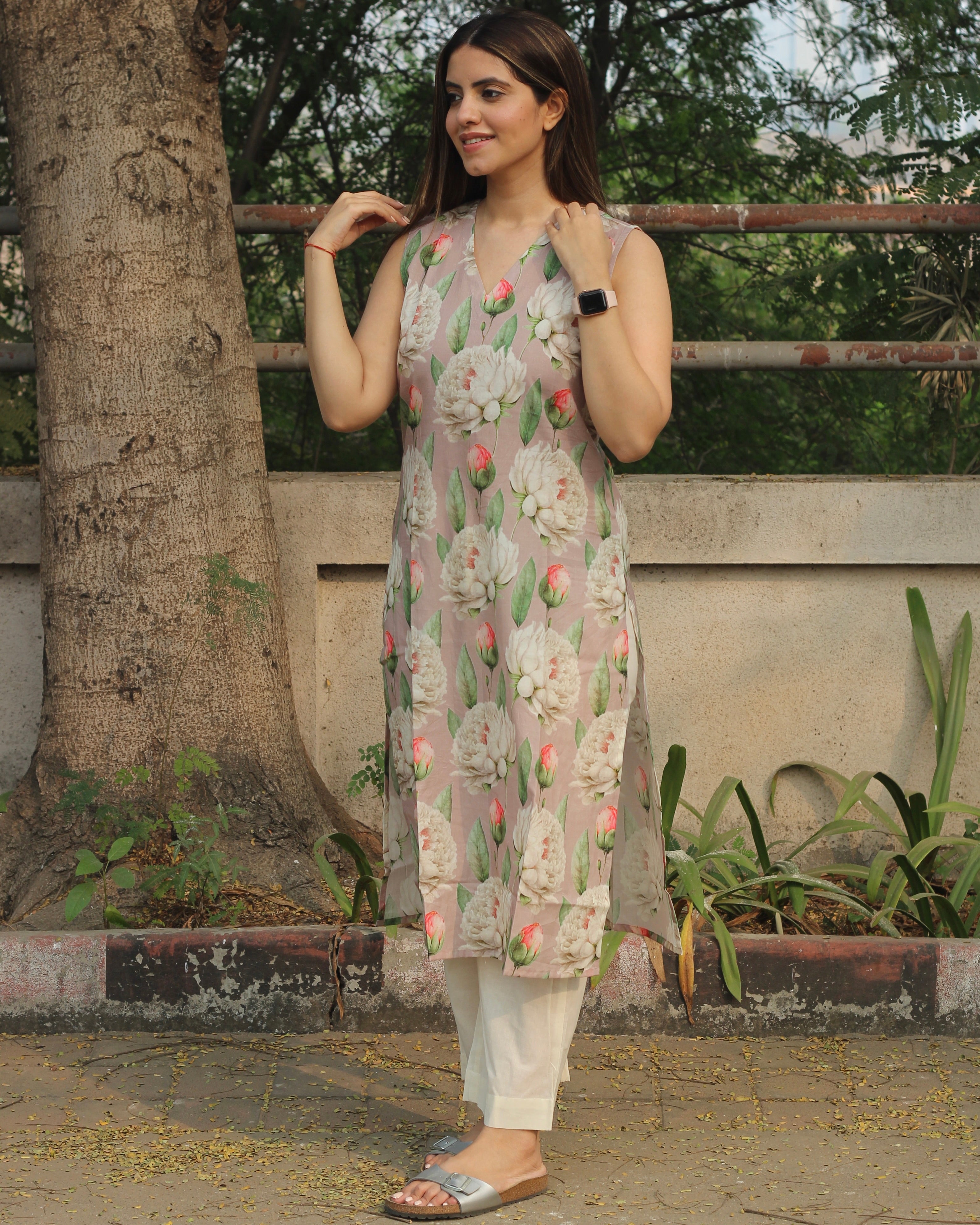 Floral Bliss Sleeveless V-neck Long Kurta in premium cotton, featuring floral print on light mauve base and side cuts, paired with white pants