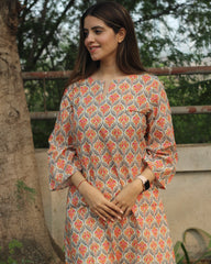 Ikkat Harmony Long Kurta in premium cotton with yellow and pink ikkat print, round neck with V-cut, and side pockets.