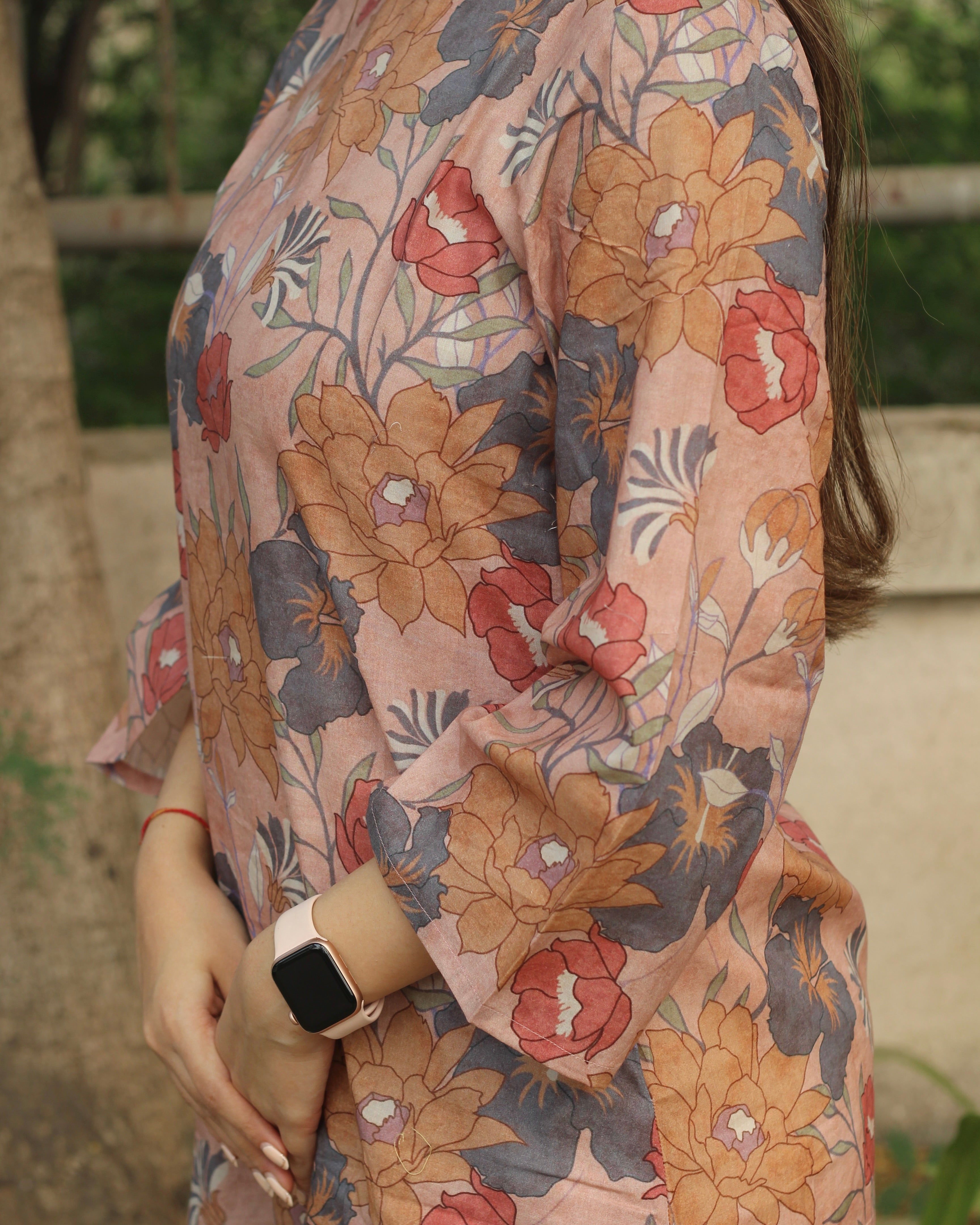 Dusty Bloom A-Line Long Kurta in premium cotton with dusty floral print, round neck, 3/4 sleeves, and side pockets
