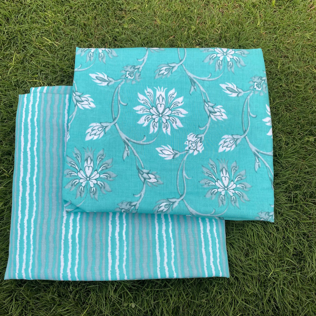 Turqoise floral top and contrasting stripes bottom set per meter price